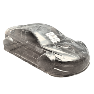 Clear plastic model car body on a white background