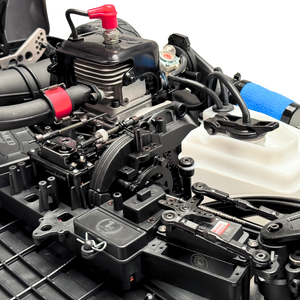 Close-up of a detailed model engine with various components and hoses.