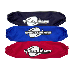 Three shock absorber covers in black, blue, and red with 'Shockwears' branding on a white background.