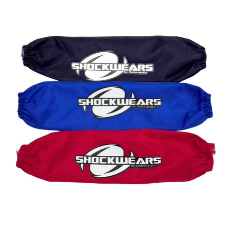 Three shock absorber covers in black, blue, and red with 'Shockwears' branding on a white background.
