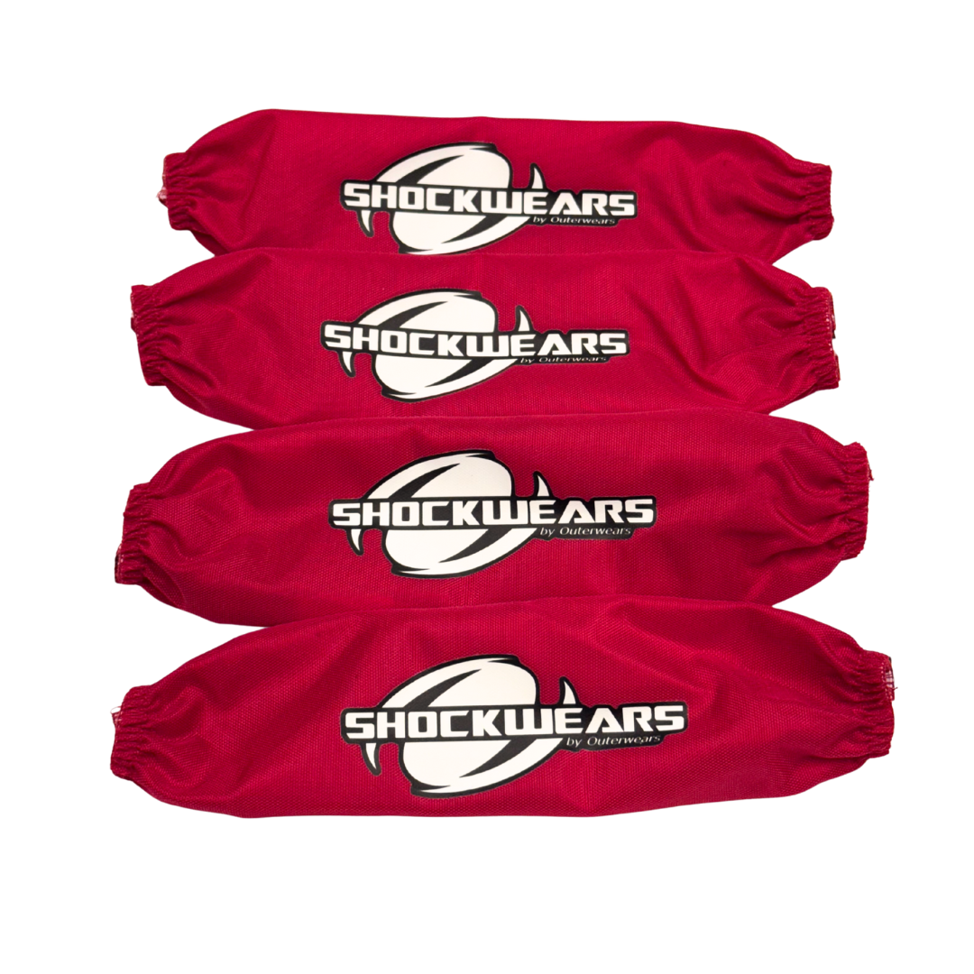 Four red 'Shockwears' protective covers on a white background