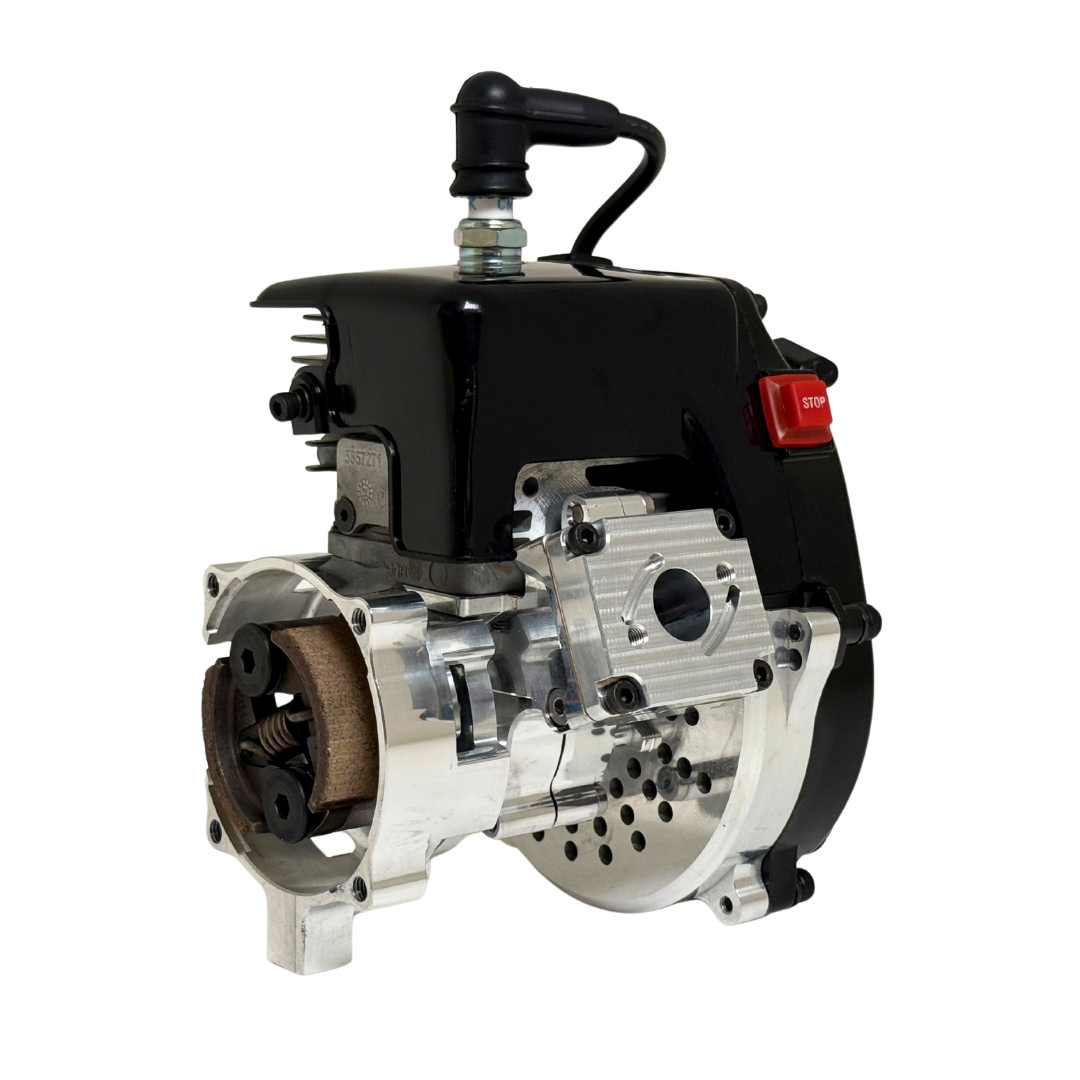 Front view of the HPRC 32cc race ported Zenoah engine showing the raw silver billet clutch bell, reed case mount and cooling vents from the opposite angle