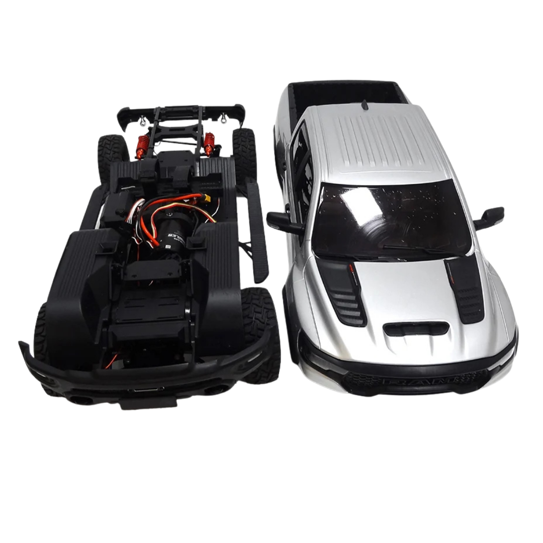 Model of a car chassis and a completed silver car on a white background