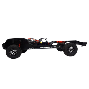 Black off-road vehicle chassis with large wheels on a white background