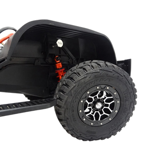 Close-up of a black off-road vehicle tire with a white background