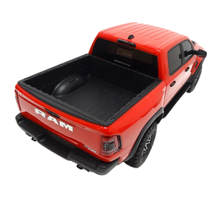 Red Ram truck with black bed cover on a white background