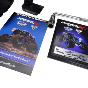 Primal RC Monster Jam Son-Uva Digger model with instruction manual and display stand on a white background