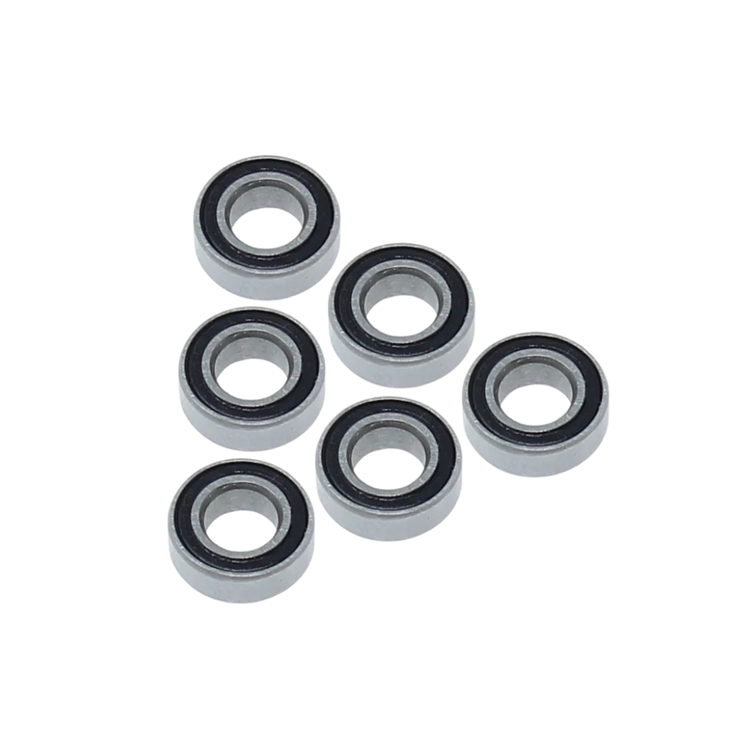 Six metal bearings arranged in two rows on a white background