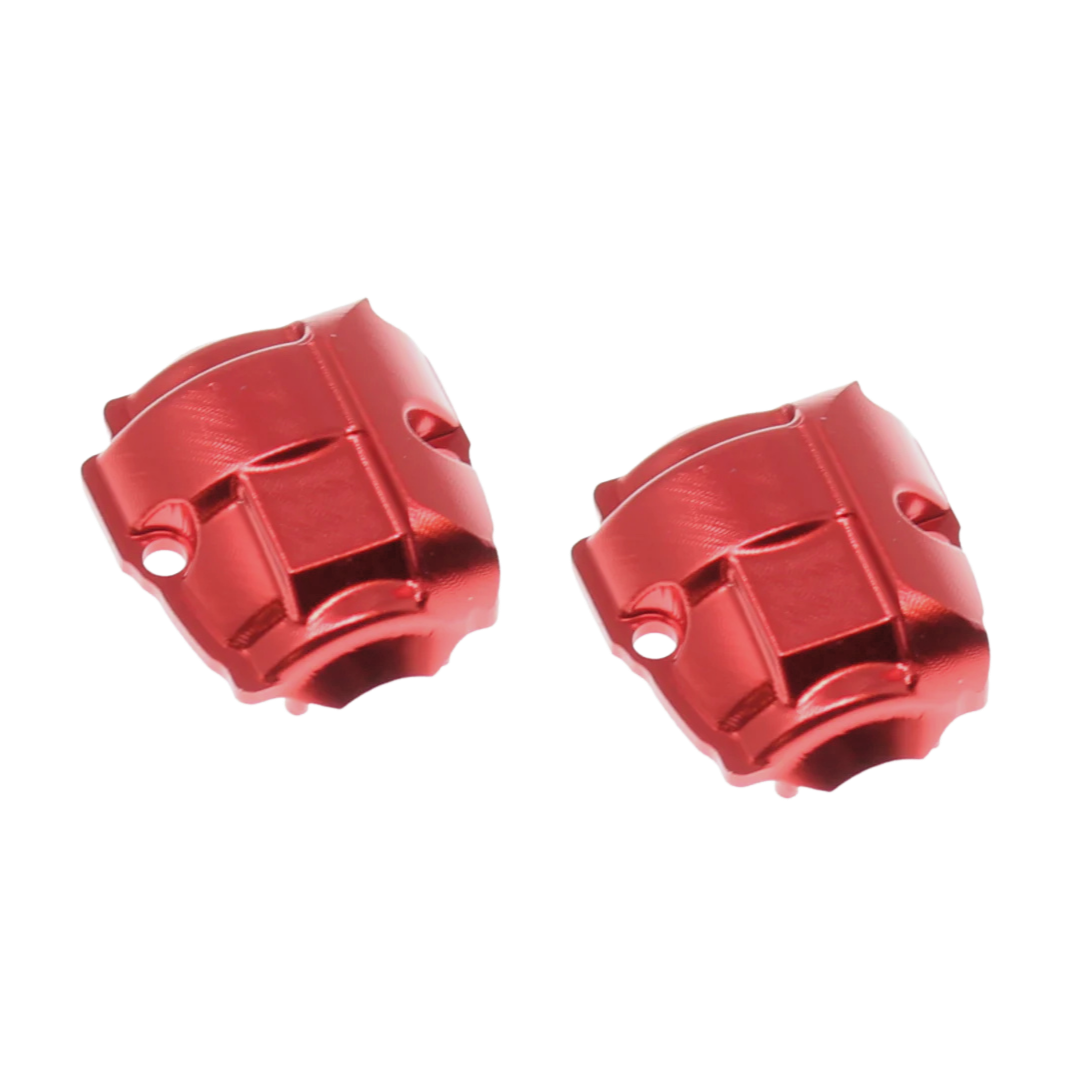 Two red metal engine blocks on a white background