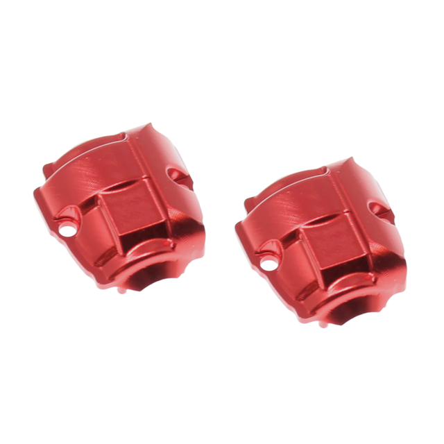 Two red metal engine blocks on a white background