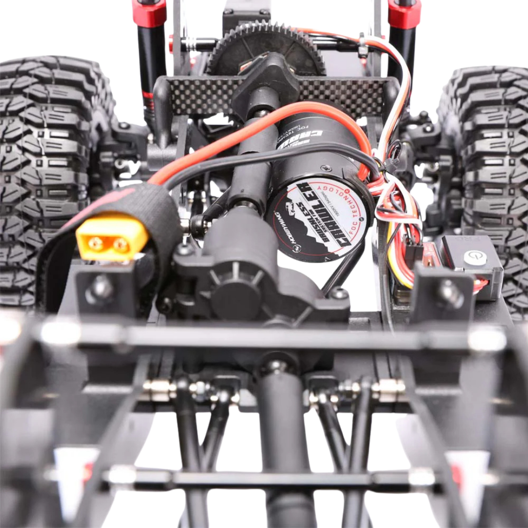 Close-up of a remote control car's suspension system with visible brand name on a white background.