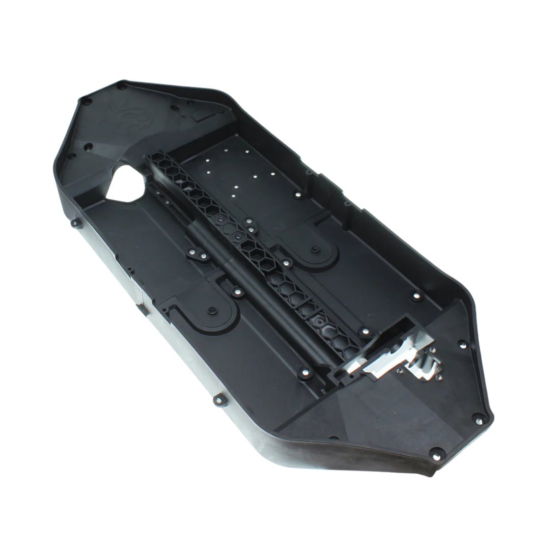 Black plastic component on a white background