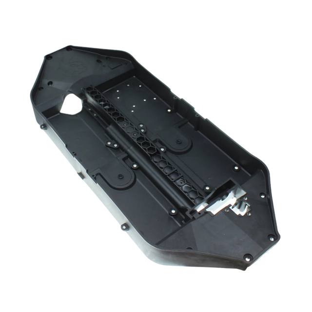 Black plastic component on a white background