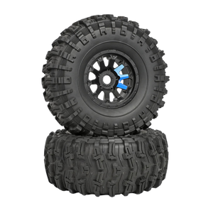 Two black off-road tires with tread patterns on a white background
