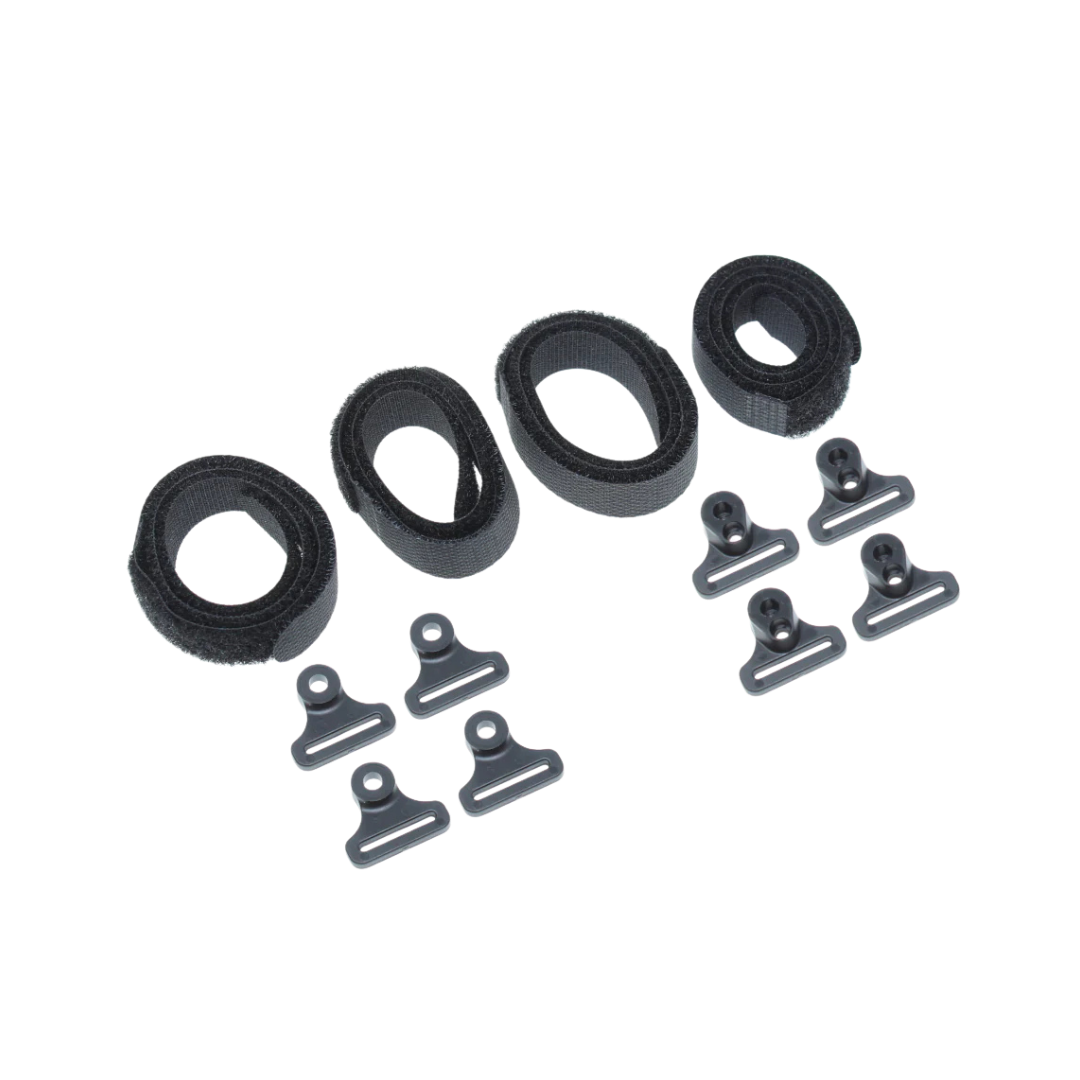 Set of black plastic clips and loops on a white background