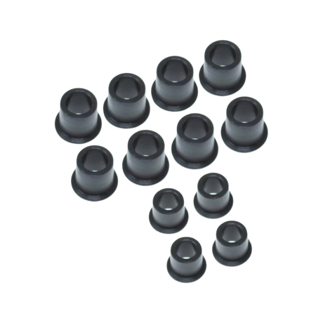Set of black bushings on a white background