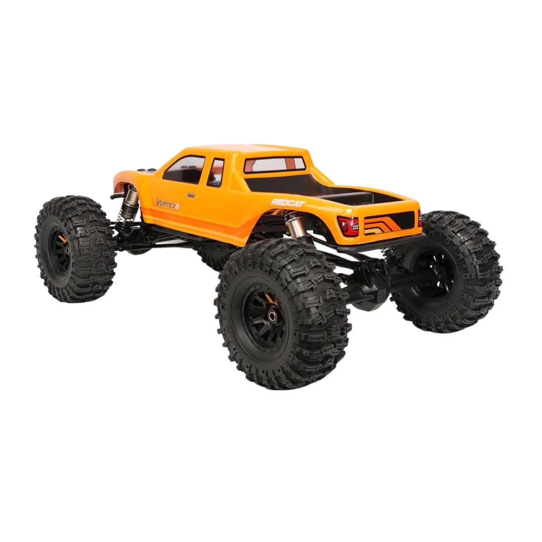 Orange monster truck with large black tires on a white background