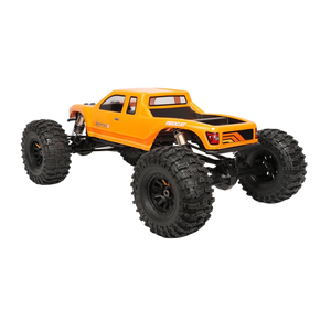Orange monster truck with large black tires on a white background