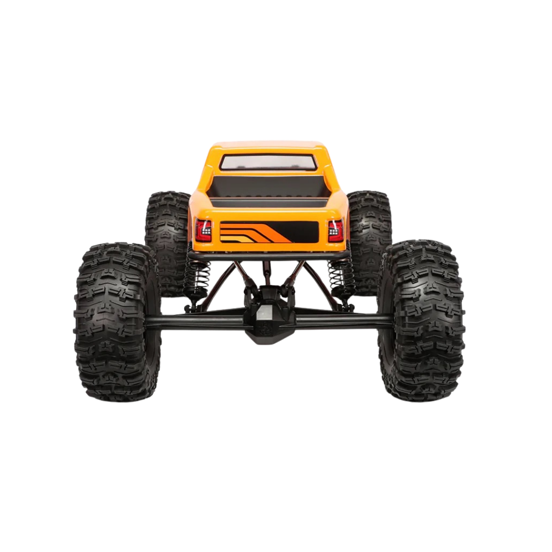 orange monster truck with large black tires on a white background