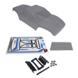 clear RC car body with decals and black parts on a white background