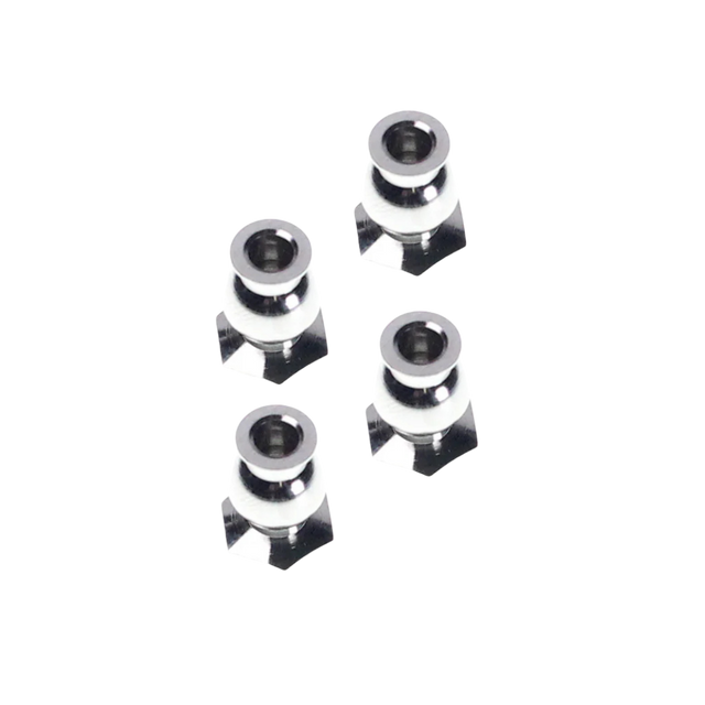 four metallic star-shaped objects on a white background