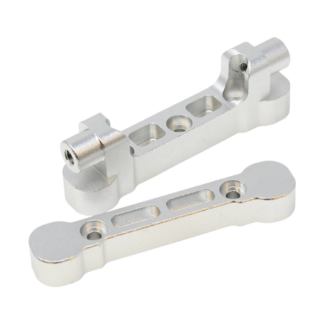 Two metallic metal brackets on a white background