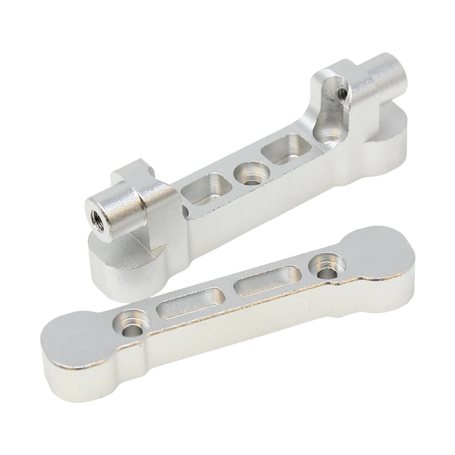 Two metallic metal brackets on a white background