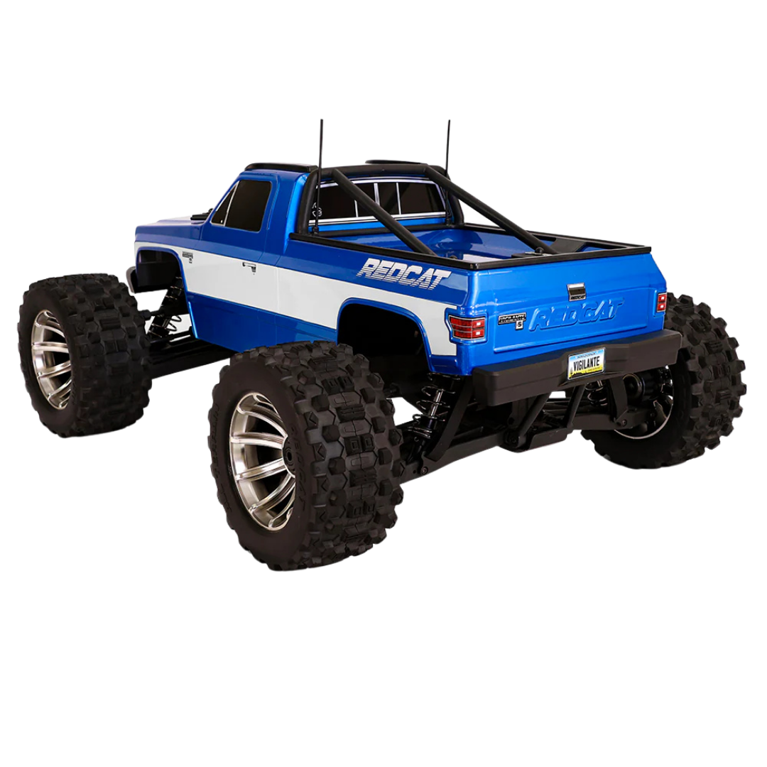 Blue and white remote control truck with large wheels on a white background