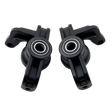 Two black plastic components with bearings on a white background