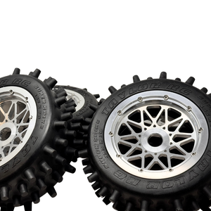 Black tires with silver rims on a white background