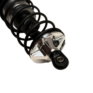 Taylor Losi 5IVE-T 3.0 raw silver billet shock perch fitted to a black shock with spring, showing the machined spokes and grub screw