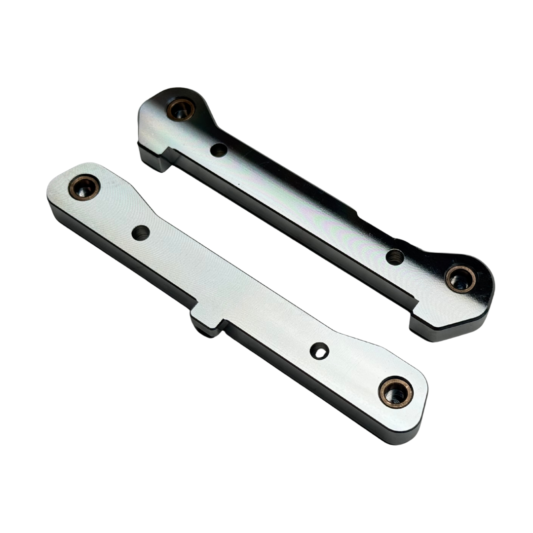 Taylor Losi 5T, 5IVE 2.0 and 5IVE-TG 3.0 raw silver billet 7075 rear hinge pin braces, underside view showing the bronze bushings and screw holes