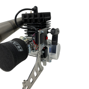 Close-up of a mechanical engine and air filter on a white background