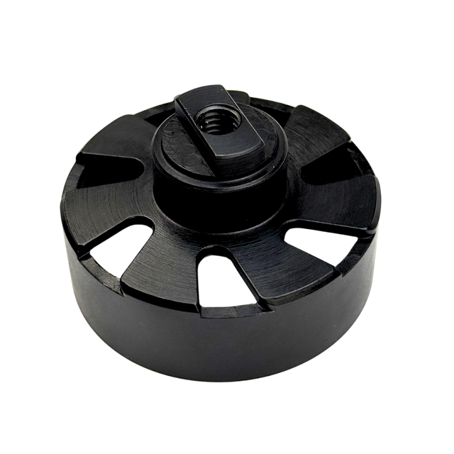 Black metal component with central threaded hole on a white background