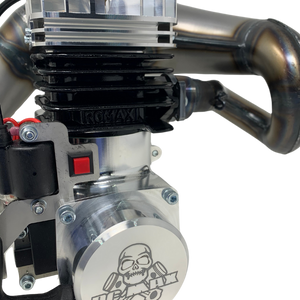 Close-up of a mechanical engine component with 'RCMAX' branding on a white background