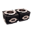 Stack of black engine cylinder heads on a white background