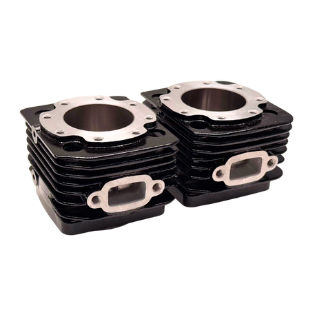 Stack of black engine cylinder heads on a white background