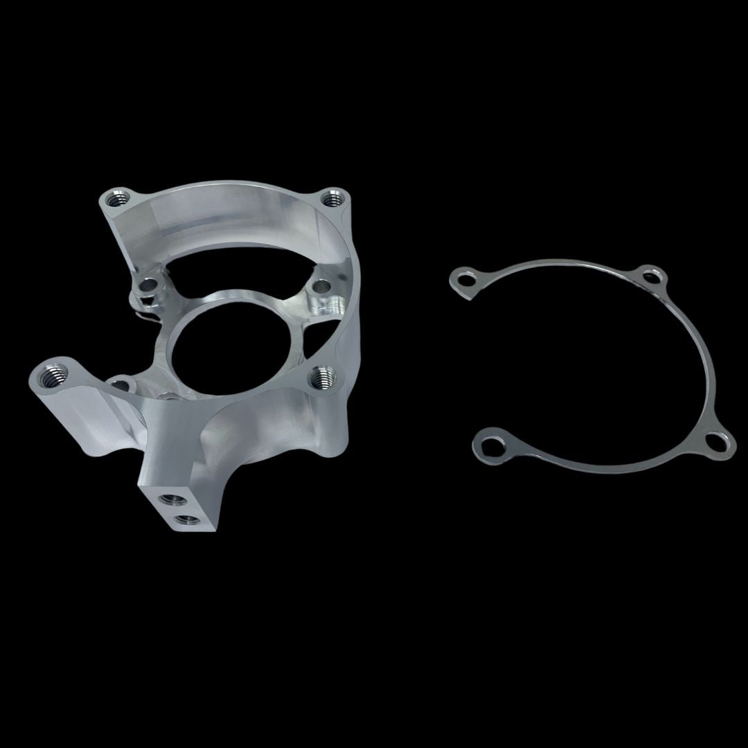 A metal clutch housing and a metal shim typically used in small engines, displayed against a black background.