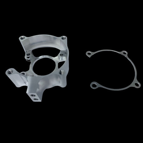 A metal clutch housing and a metal shim typically used in small engines, displayed against a black background.