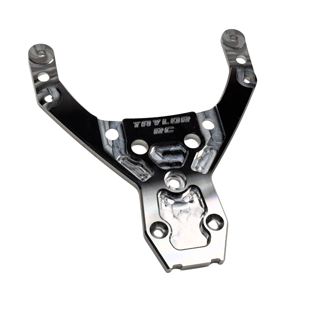 Metallic mechanical component with 'Taylor RC' branding on a white background