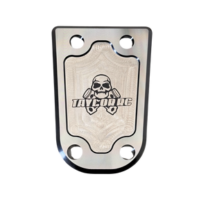 Metallic plate with skull design and 'Taylor RC' branding on a white background