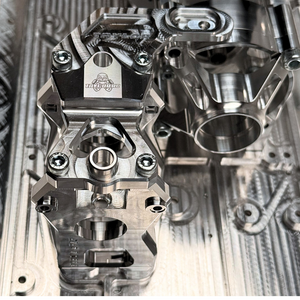 Close-up of metallic engine parts on a textured metal surface