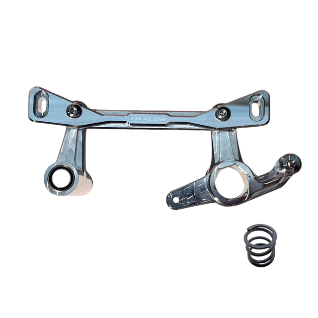 A silver metal suspension link assembly with a black coil spring, shown on a plain white background. The brand name 'TAYLOR' is embossed on the center bar.