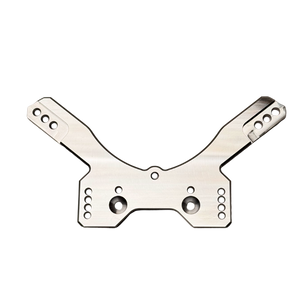 Taylor RC OUTLAW drop rear shock tower in raw silver, flat top-down view showing the mounting holes and central cutout from a slightly different angle