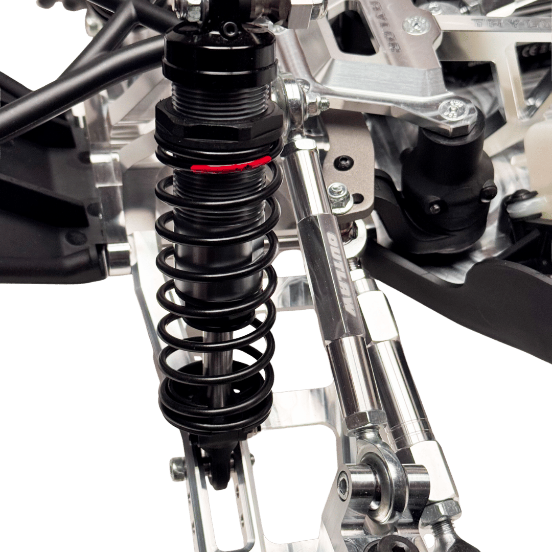 Close-up of a suspension system on a vehicle with a clear background