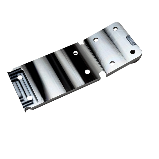 Taylor RC OUTLAW V4 front chassis insert in raw silver, angled view of the counterbored top face showing the mounting holes and ribbed sections