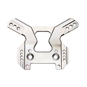 Taylor RC OUTLAW V4 front shock tower in raw silver, flat top-down view showing the full symmetrical arm layout and central cutout