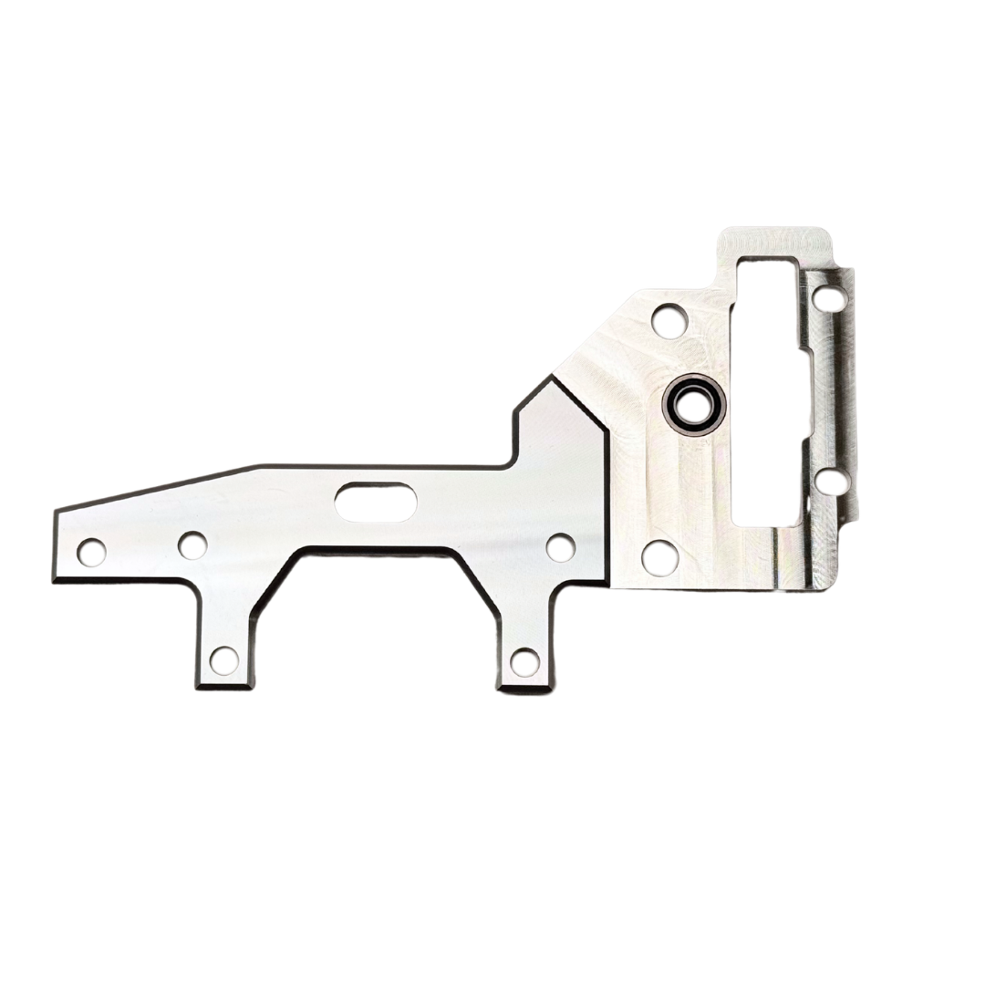 Taylor RC OUTLAW V4 upper transmission plate in raw silver, flat view showing the mounting holes, bearing bore, and slotted cutout