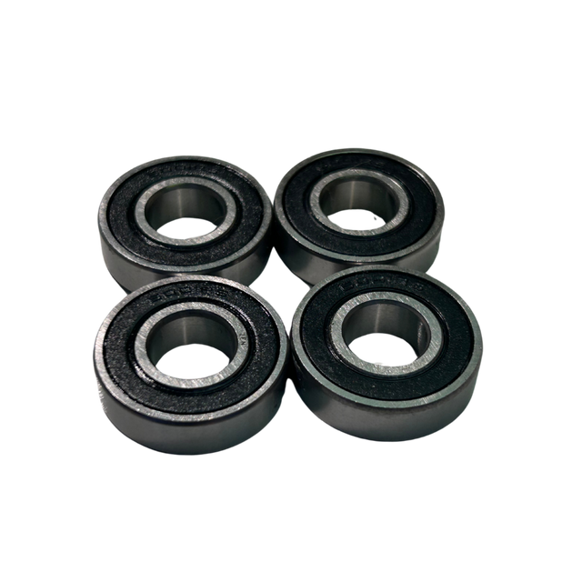 Four black bearings on a white background
