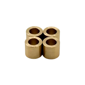 Four cylindrical brass bearings arranged in a cross formation on a white background.
